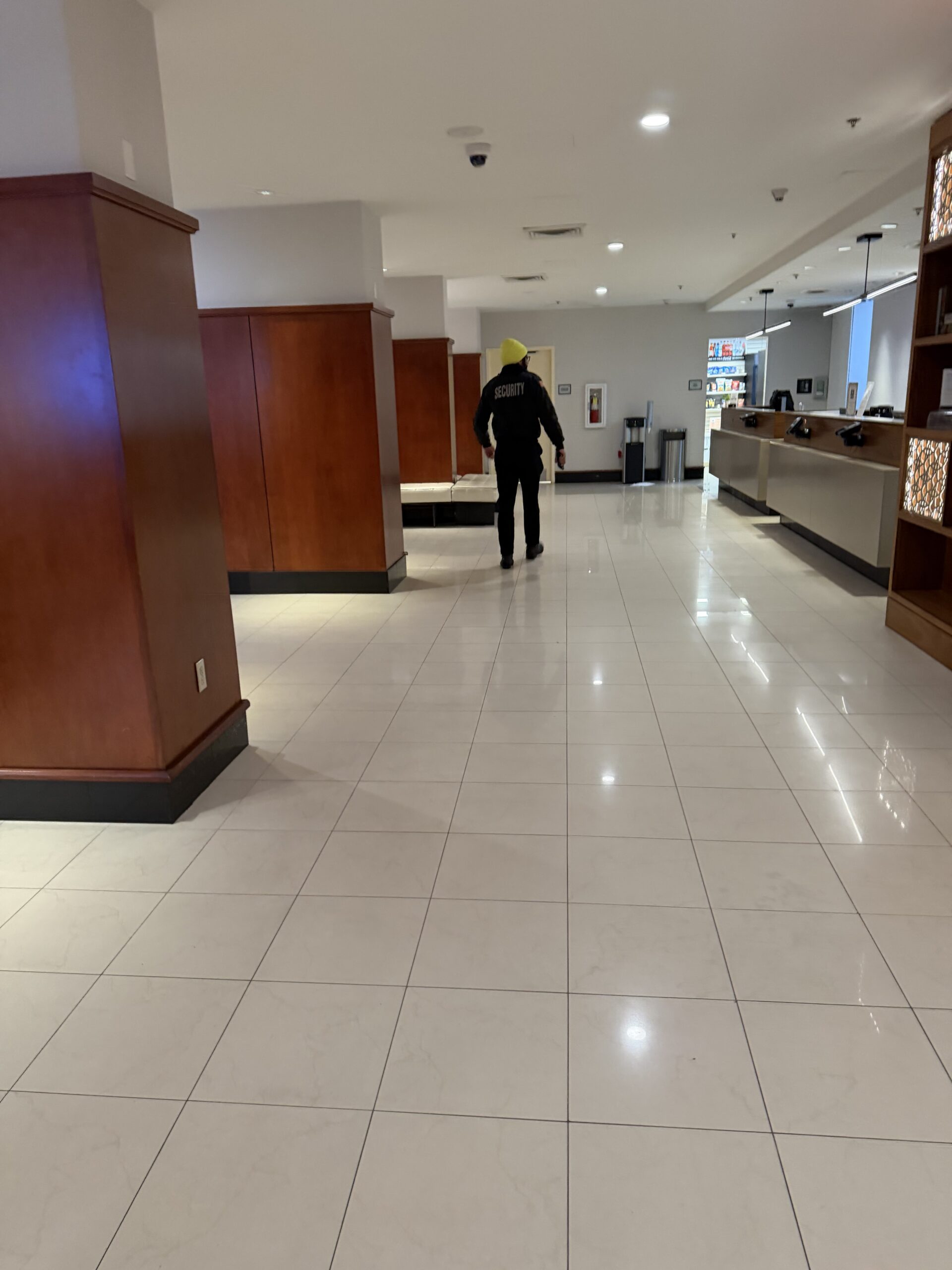 SecurityRI officer conducting proactive patrol rounds at Providence hotel reception area