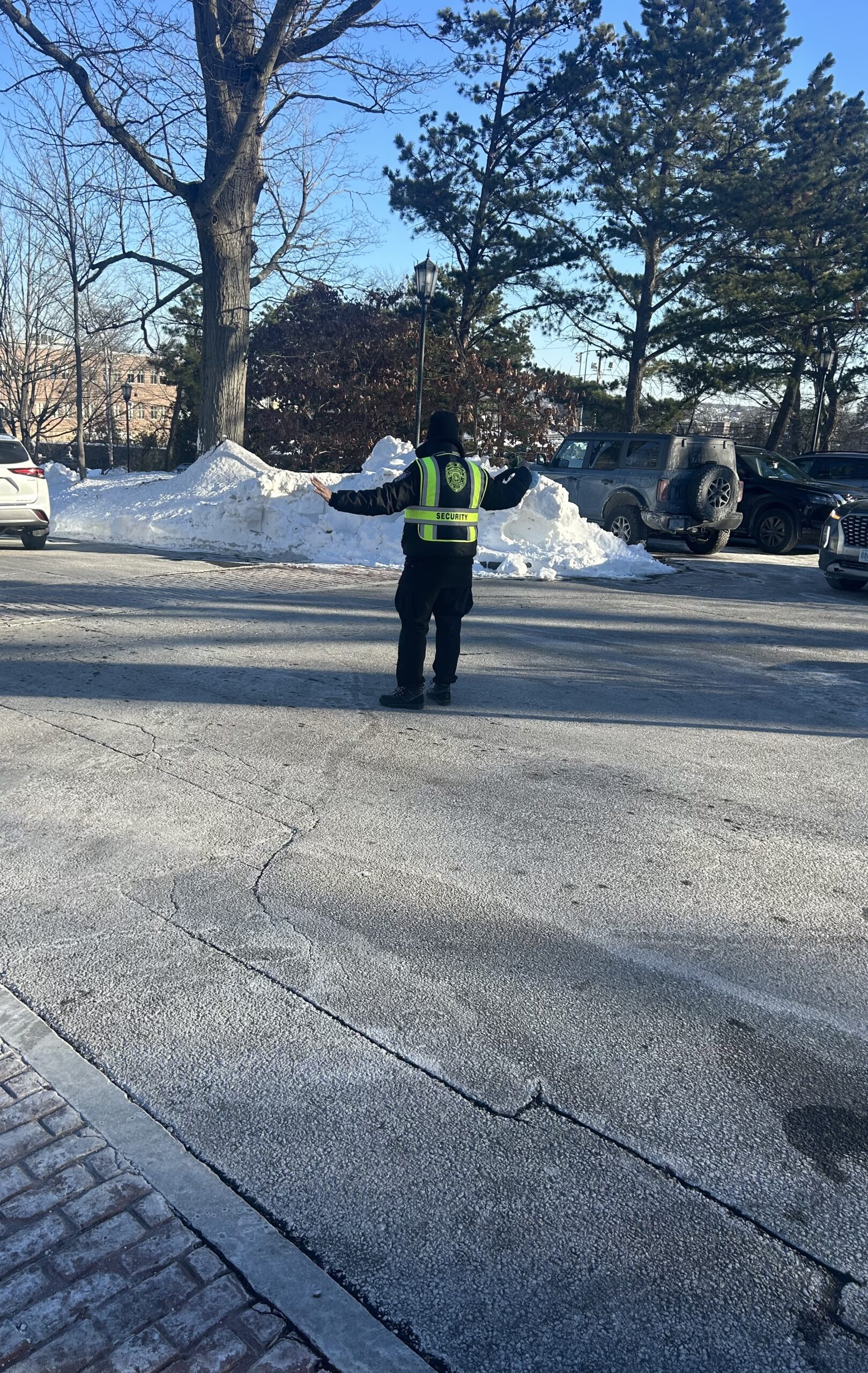 SecurityRI security officer providing K-12 school security at Providence Rhode Island campus entrance